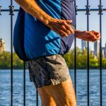 A man jogging around the reservoir in Central Park in spring.